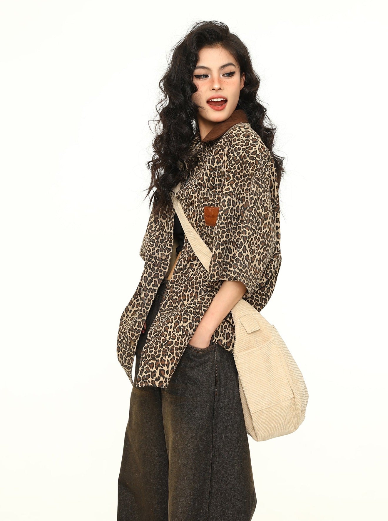 Side rear view of women's brown leopard print oversized workwear shirt showing relaxed longline fit and contrast collar