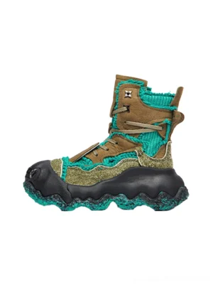 Green and brown abstract splash layered platform combat boots with fuzzy mixed-material upper, black sculptural sole, and high-top streetwear silhouette