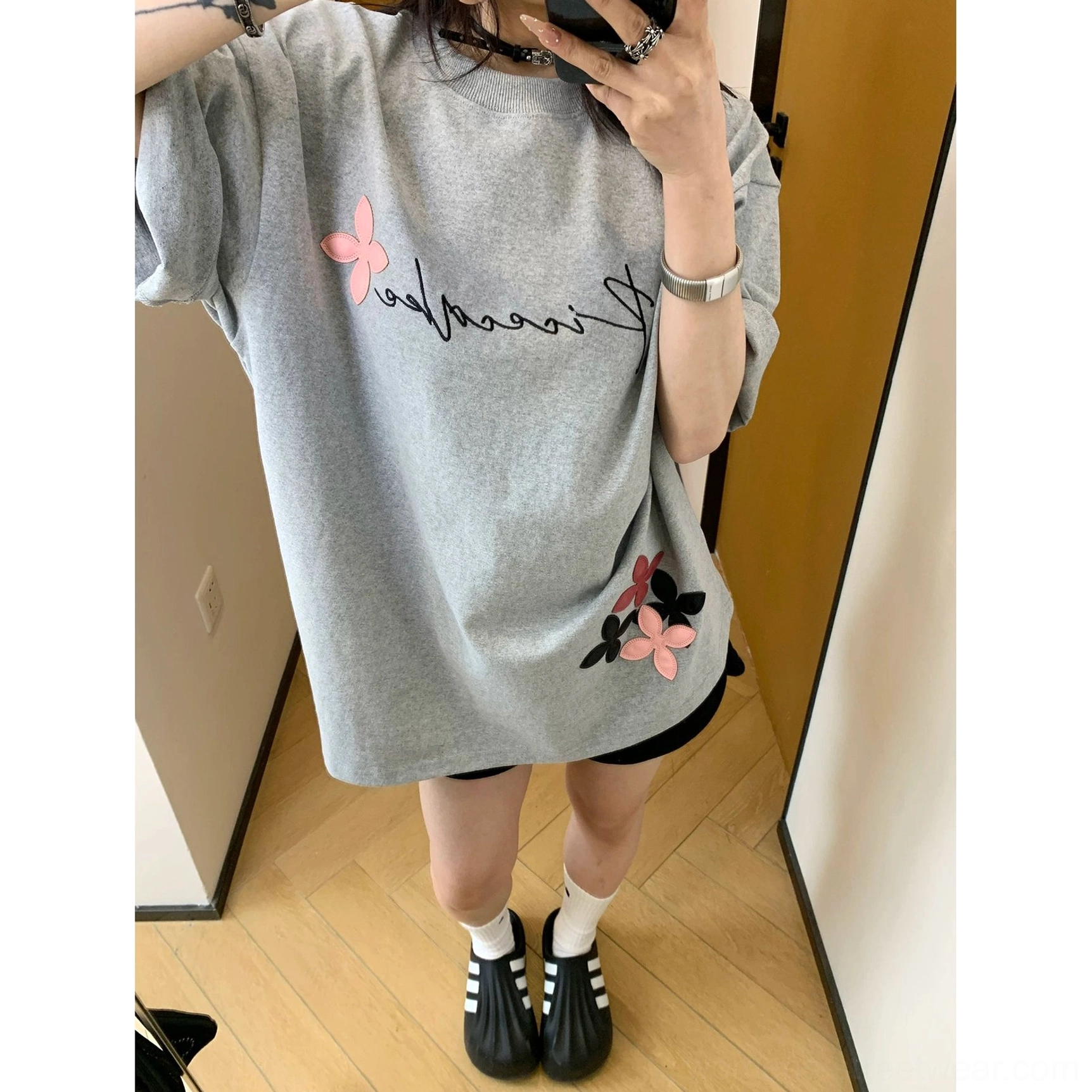 Acubi inspired oversized floral graphic T-shirt with artistic script print, relaxed proportions, and easy everyday layering potential