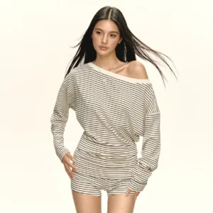Front view of cream and black striped off-shoulder lounge top with loose long sleeves, ruched waist, and relaxed Acubi-inspired Korean streetwear styling