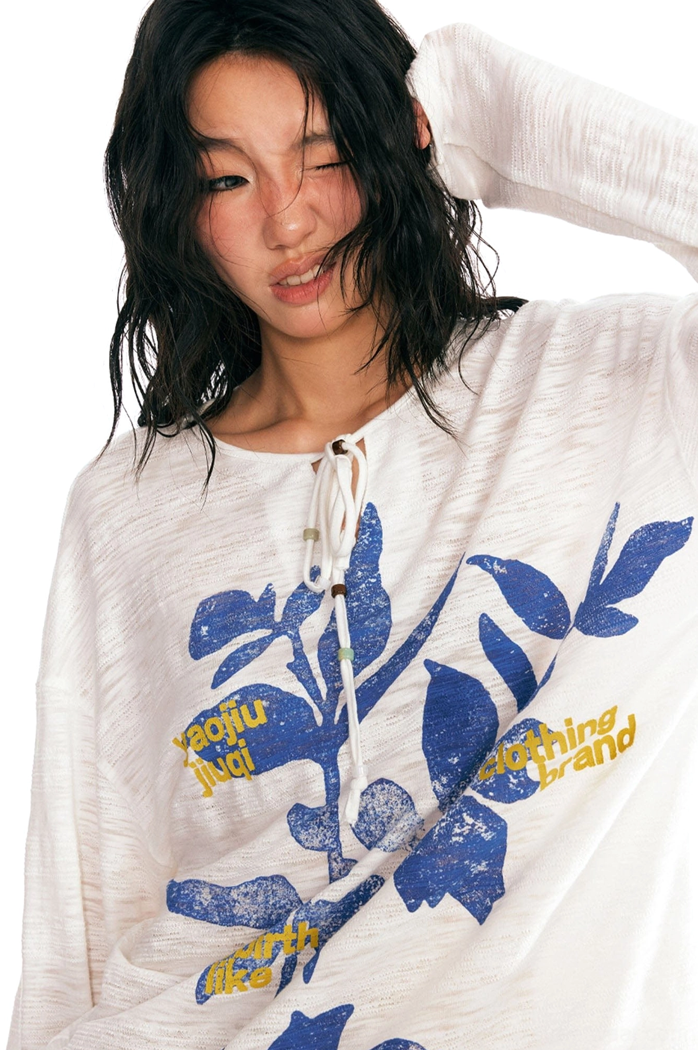 Sesame leaf drawstring neck graphic long-sleeve tee product detail showing contemporary Acubi streetwear styling