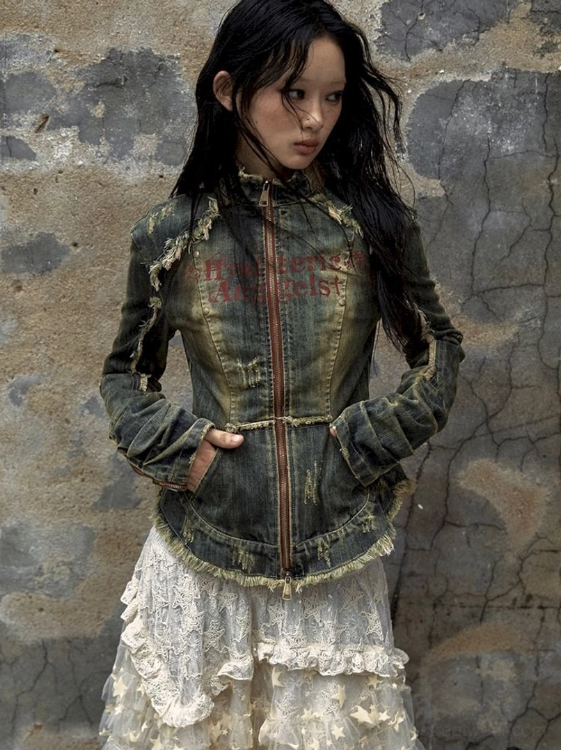 Acubi style distressed denim corset jacket in faded blue with zip front design