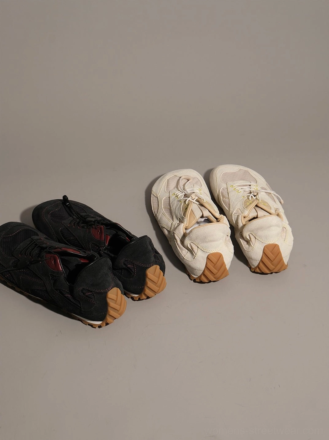 Acubi style low-profile trainers with layered nubuck panels and clean streetwear finish