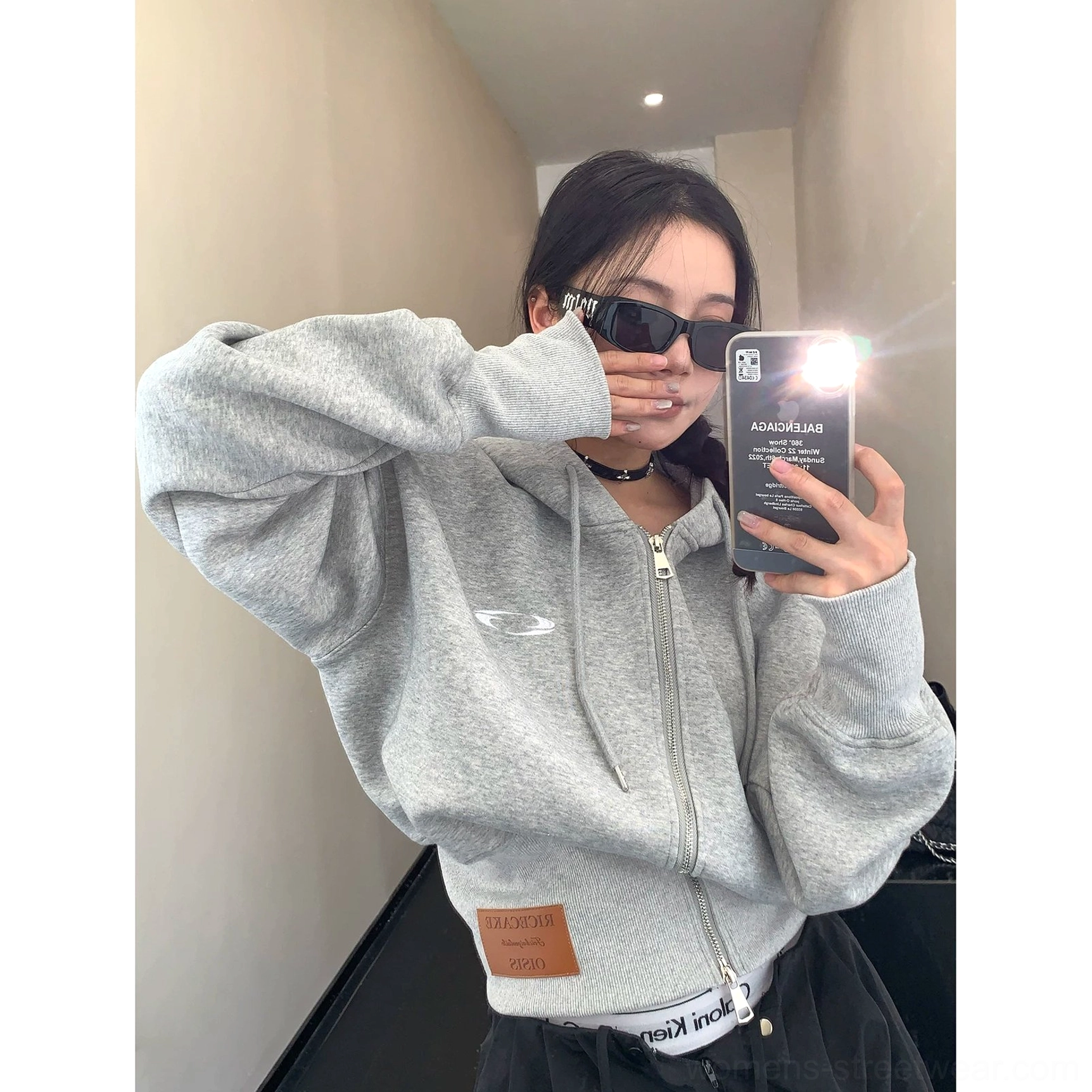 Acubi-inspired washed cropped hoodie designed with oversized proportions, ribbed cuffs, adjustable hood drawstrings, and layered streetwear appeal