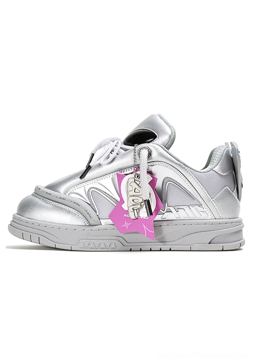 Silver gray alien head platform sneakers with pink alien hangtag and sculpted chunky sole, side studio view