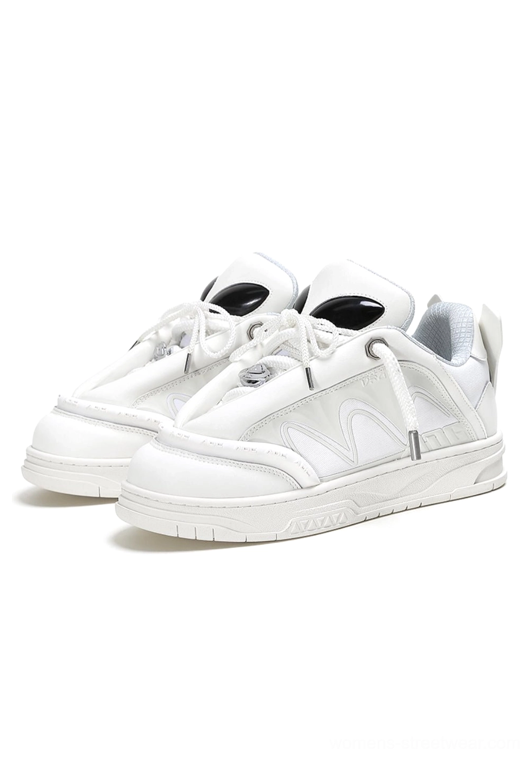 White alien head platform sneakers with lace-up closure and extraterrestrial tongue accents, front studio view