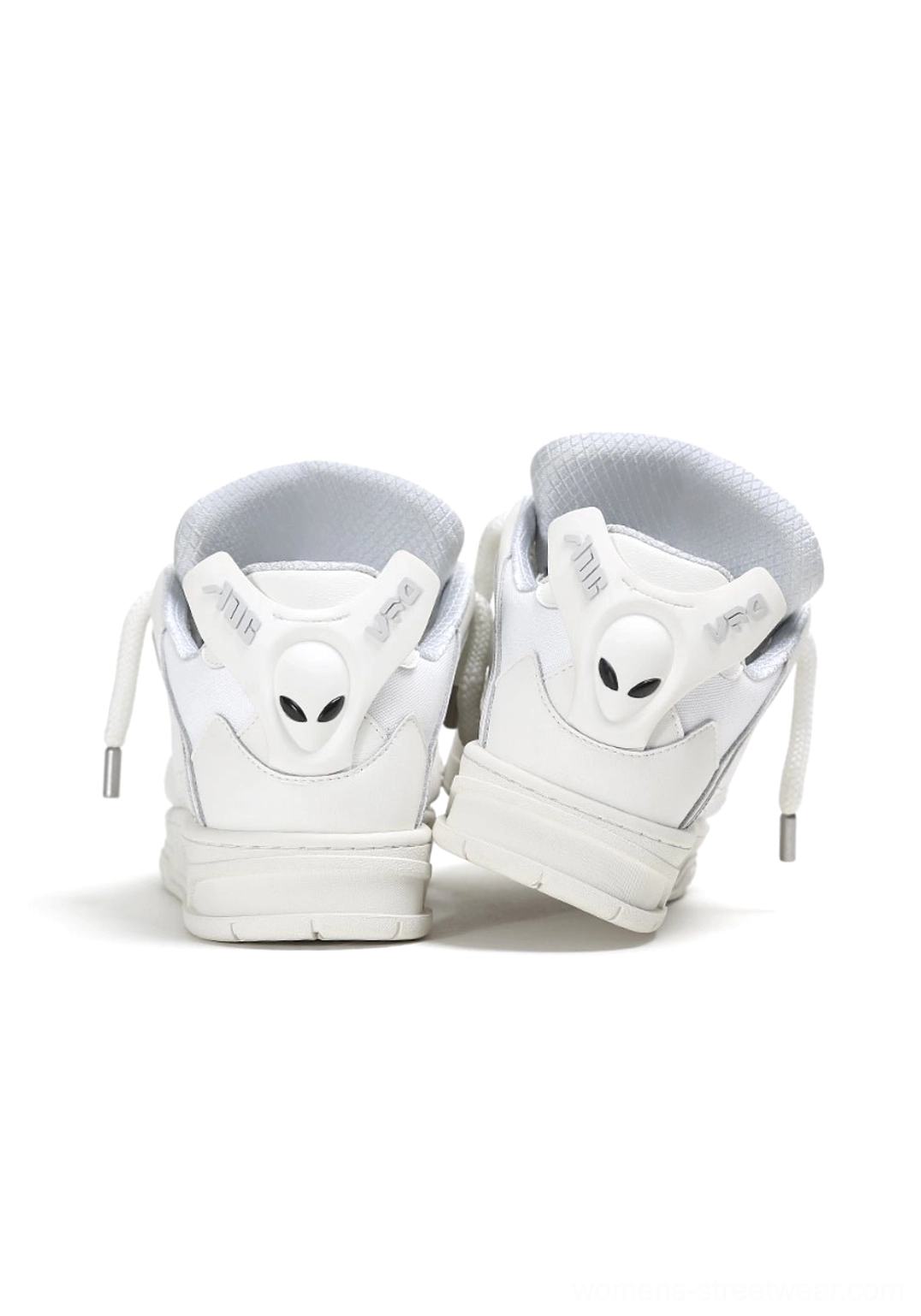 White alien head platform sneakers rear view with alien heel accents and pull tabs on a studio background