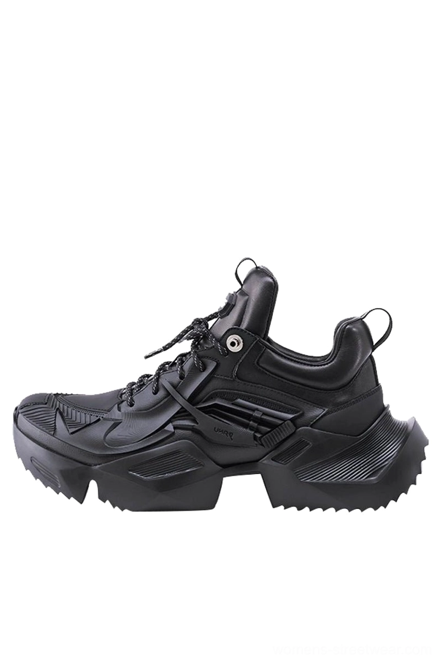 All-black 3D-printed platform sneaker with a sleek futuristic silhouette, matte finish, geometric upper, and thick jagged streetwear outsole