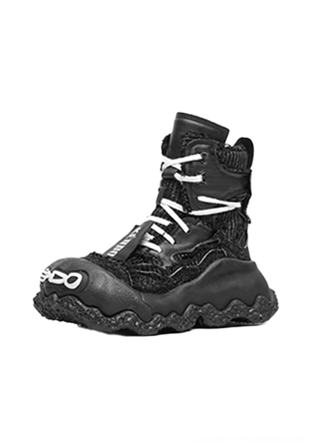 All-black abstract splash layered platform boots with textured upper, white contrast laces, printed toe detail, and oversized sole