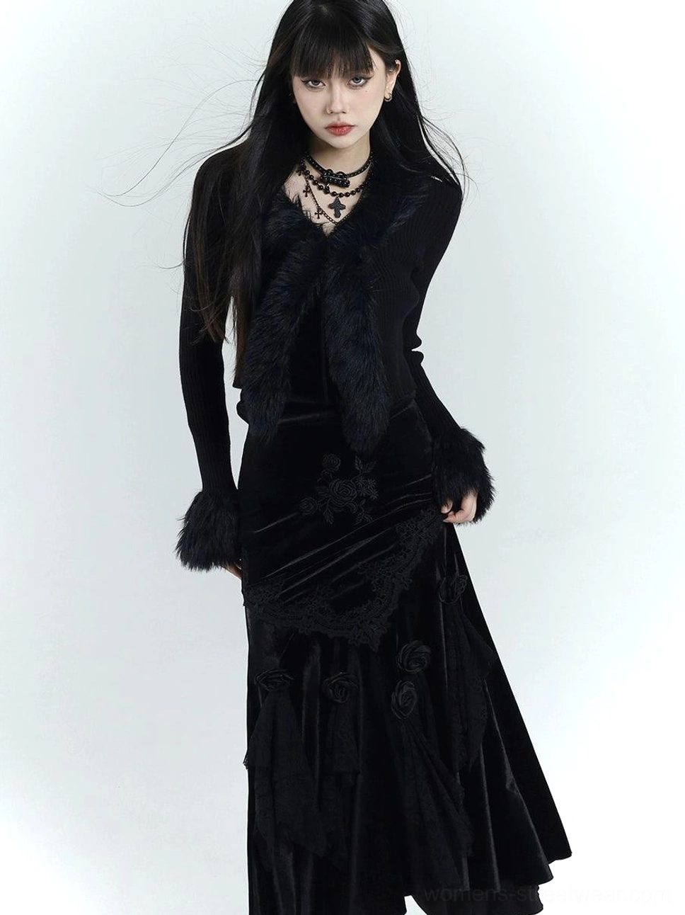 Front view of an all-black gothic velvet mermaid dress with faux fur collar, fuzzy cuffs, embroidered lace bodice, and layered choker