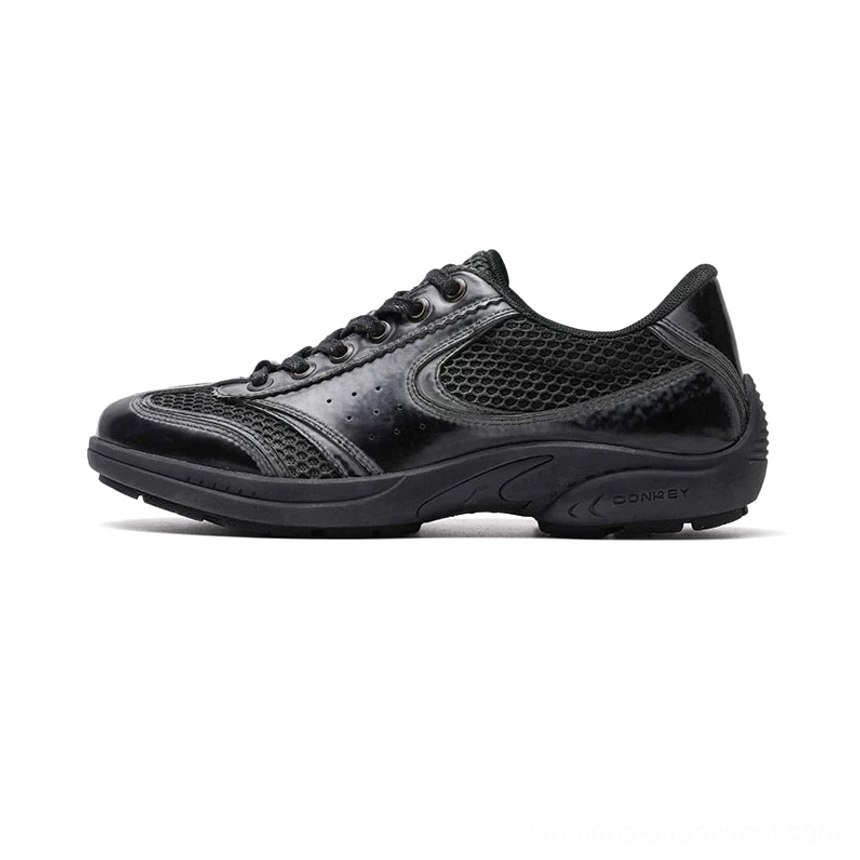 All black retro court sneakers with mixed leather and mesh upper curved side accents and textured rubber outsole
