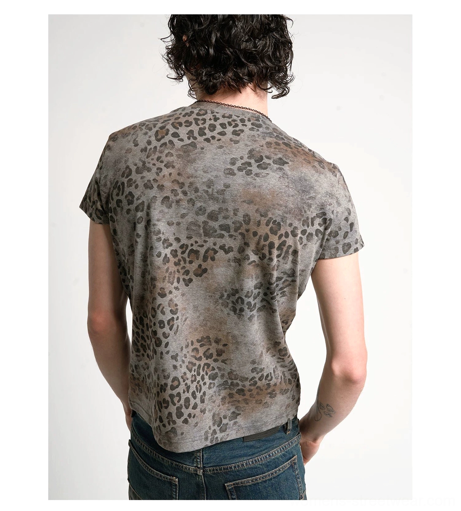 Rear full-body view showing the allover faded leopard pattern and classic short sleeve silhouette of the Henley tee