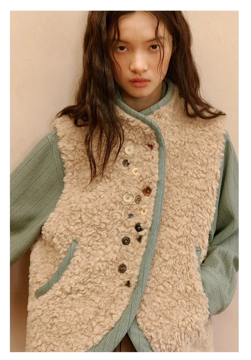Almond beige color-block sherpa vest product detail with sage green trim, mixed decorative buttons, and side slip pockets