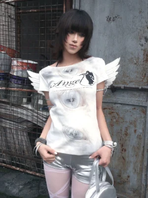 Front portrait of cloud white Angel Eyes winged shoulder baby tee with layered eye print, Angel script and dimensional shoulder wings