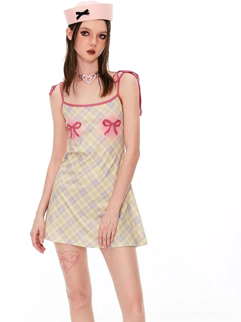 Angel graphic gingham mini dress with playful check pattern and red accent details for streetwear outfits