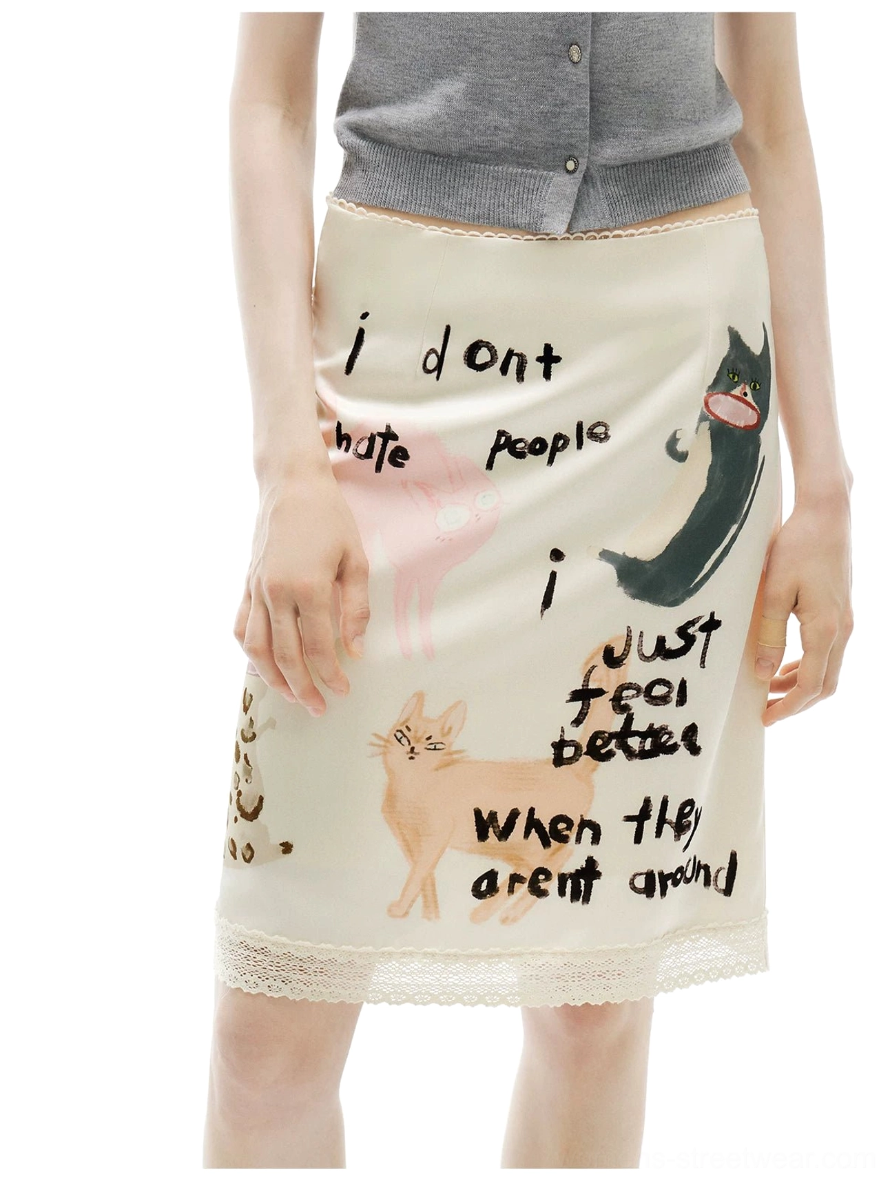 Close-up of the anti-social kitty scribble skirt showing handwritten English phrases, cartoon cat graphics, and delicate trim