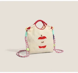 Off white apple core embroidered canvas mini crossbody tote bag with red handle and colorful braided strap