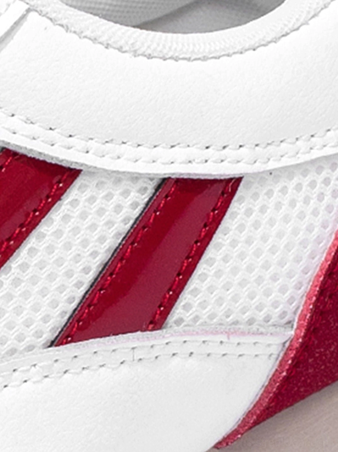 Apple detail red mesh retro runner sneakers for women showing low-top profile padded collar and ridged sole