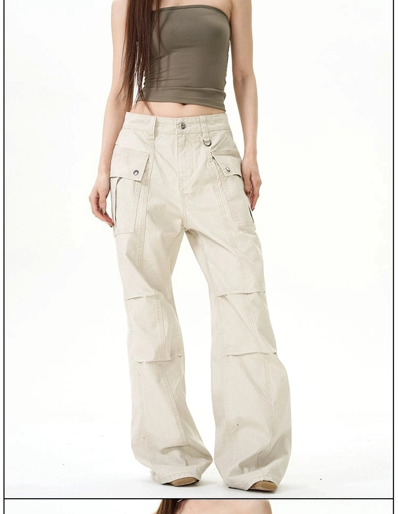 Apricot beige panel seam wide-leg cargo pants with front flap pockets and relaxed streetwear silhouette