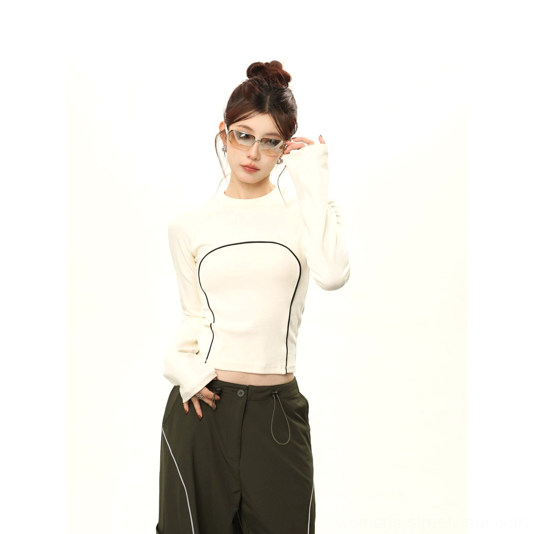 Apricot contrast stitch cropped long sleeve streetwear top front view with black seam details