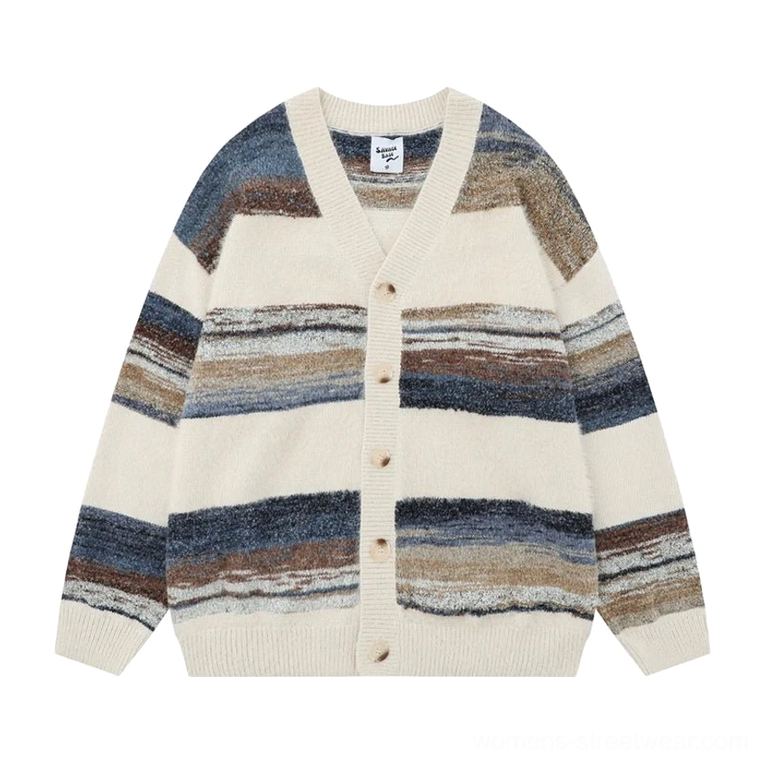 Flat lay apricot cream striped mohair cardigan with blue and brown gradient stripes V-neck front buttons and fuzzy knit finish