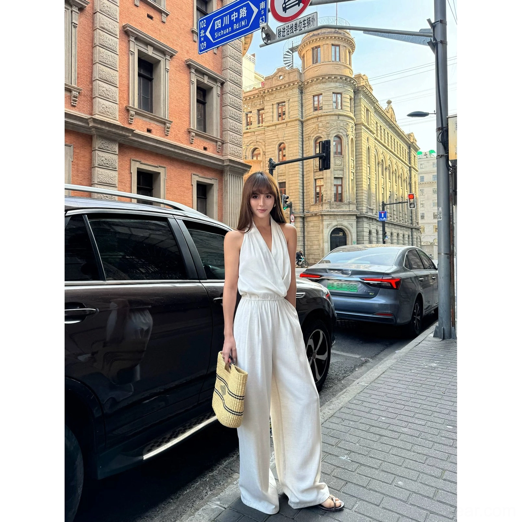 Apricot draped halter wide-leg jumpsuit for vacation dressing, summer events, and contemporary street style