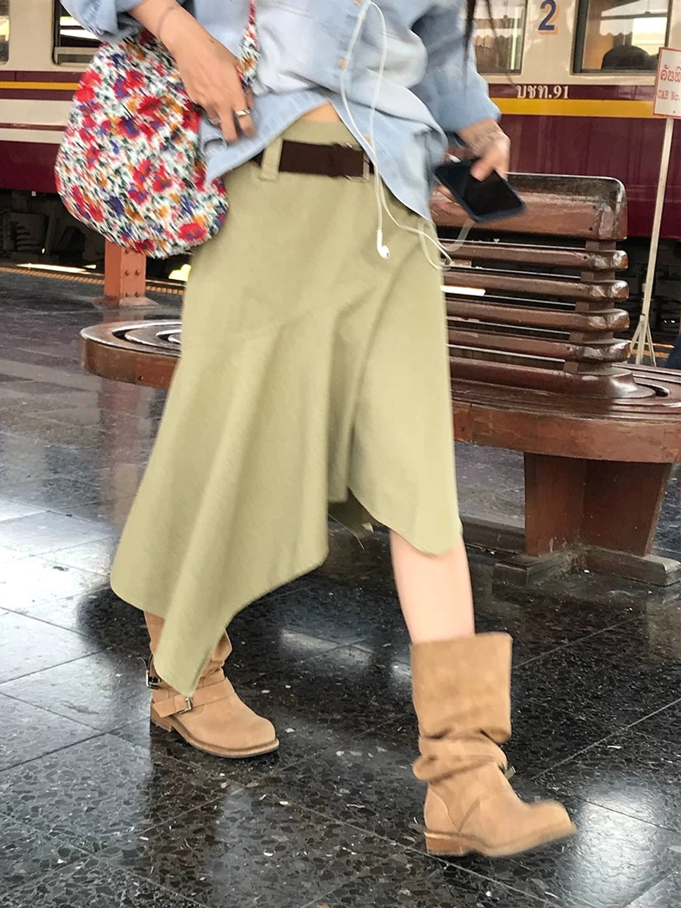 Apricot khaki asymmetric high-waist cotton midi skirt styled with suede boots in a retro streetwear setting