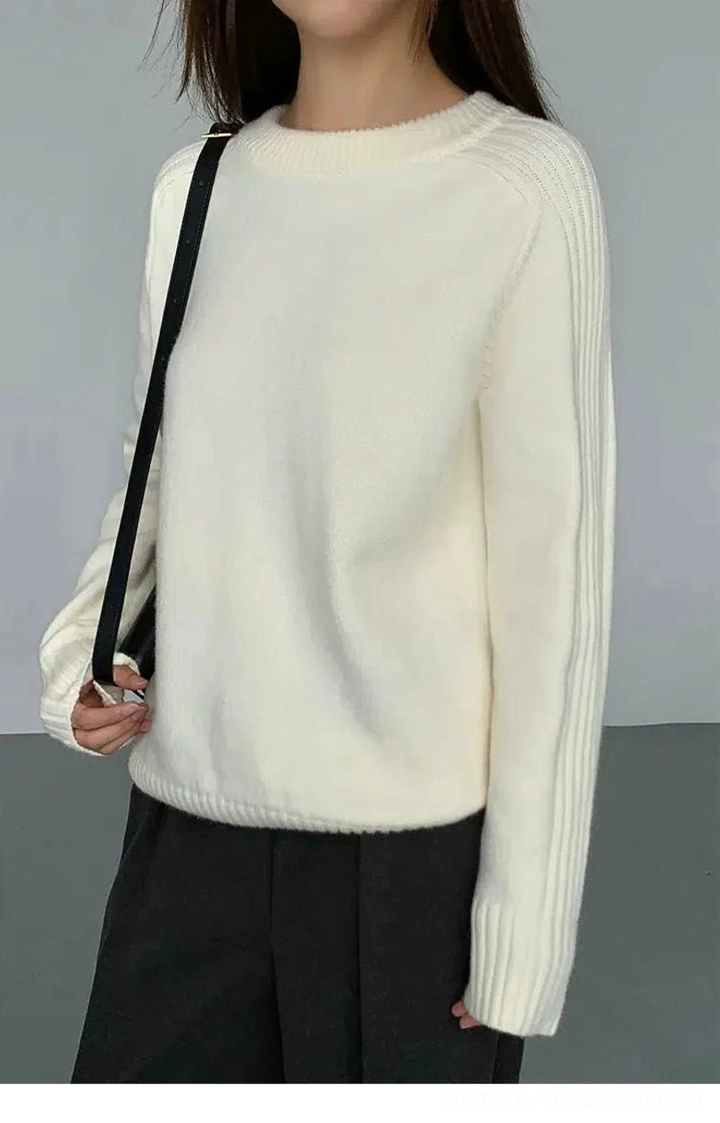 Side view of Apricot Korean streetwear crew neck sweater with long loose sleeves and crossbody bag styling