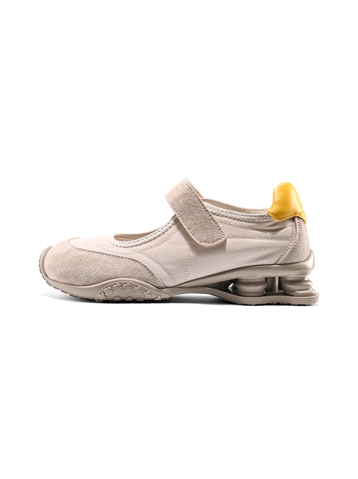 Apricot Mary Jane air cushion ballet trainers with light mixed-material upper, yellow heel pull tab, adjustable strap, breathable mesh details, and sculpted cushioning outsole in studio view