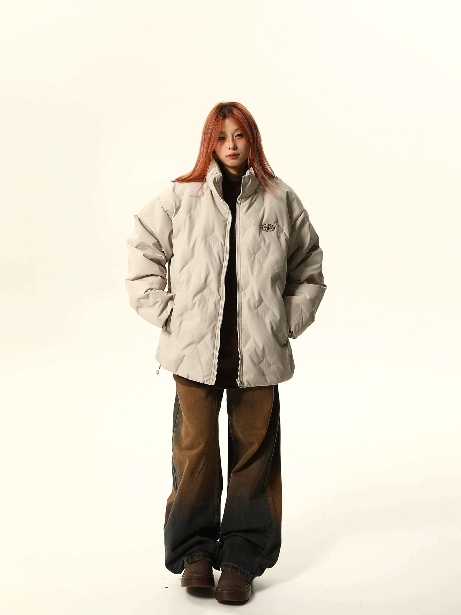 Apricot oversized stand-collar puffer bomber jacket with relaxed fit, hidden hand pockets, and minimalist chest logo