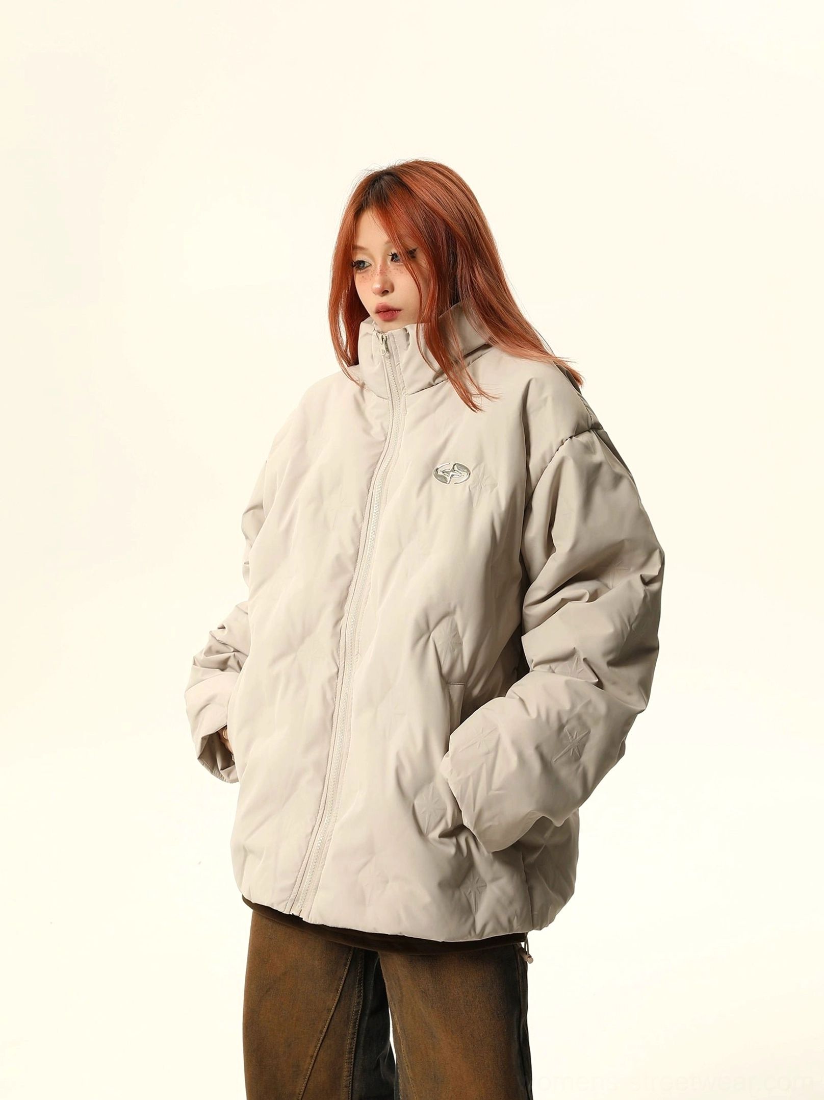 Apricot oversized quilted bomber jacket with clean stand collar, diamond quilting, chest embroidery, and hidden side pockets
