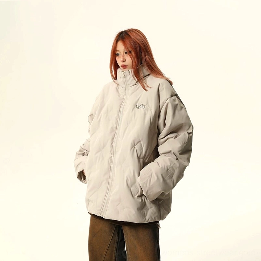 Apricot oversized quilted puffer bomber jacket with stand collar and clean Acubi-inspired streetwear aesthetic