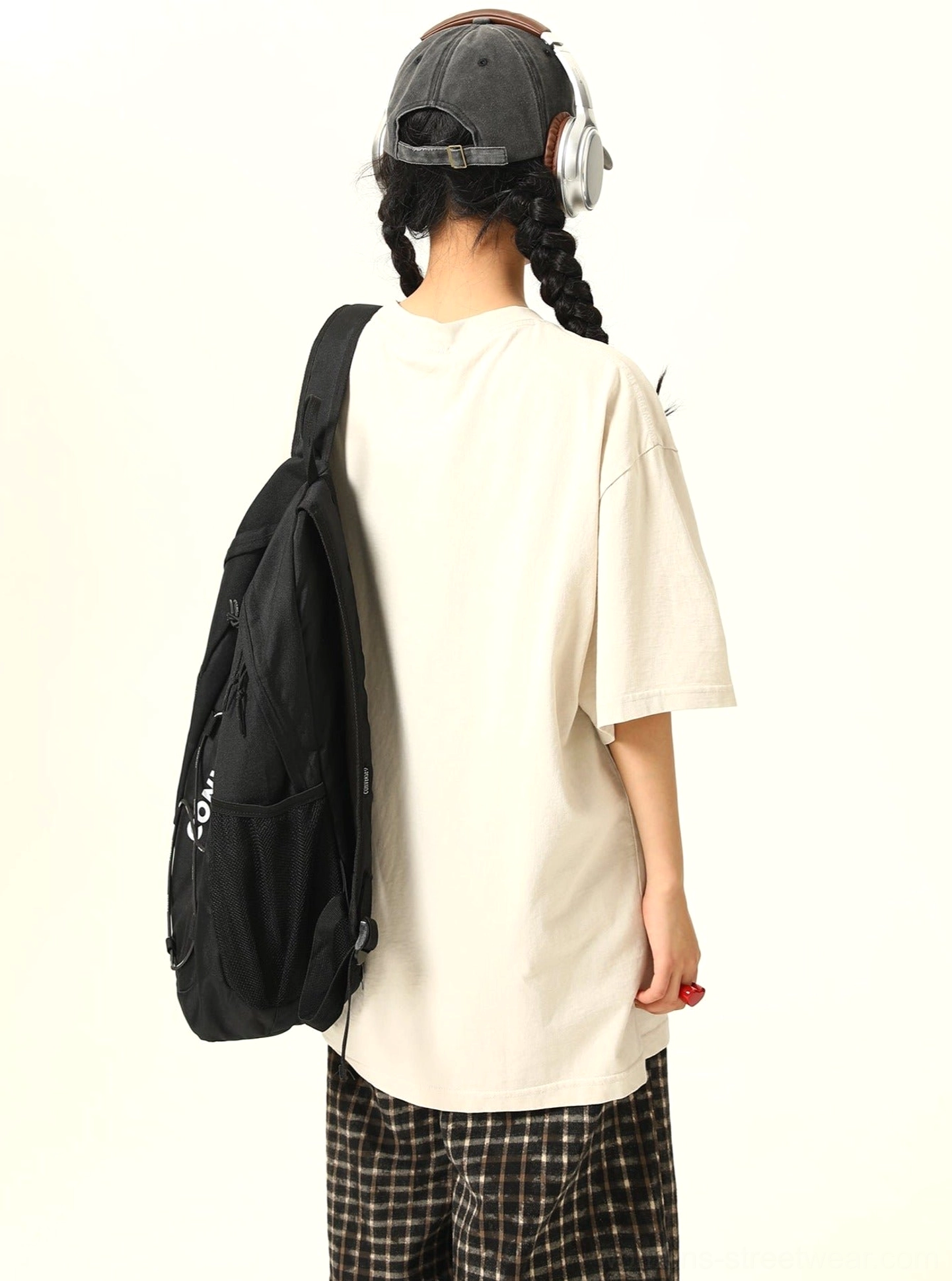 Back view of apricot oversized shadow print graphic T-shirt showing the relaxed loose fit and clean back design