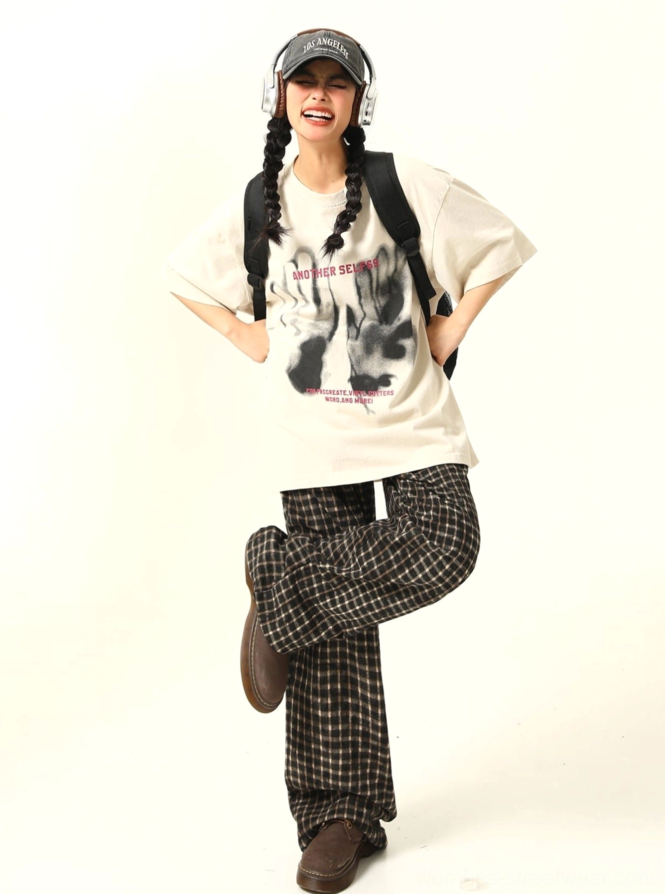 Apricot oversized shadow hand graphic T-shirt shown from the front with bold pink lettering and relaxed Korean street style proportions