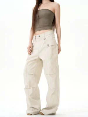 Apricot beige vintage wide-leg cargo pants with loose silhouette and flap side pockets styled with a brown strapless top