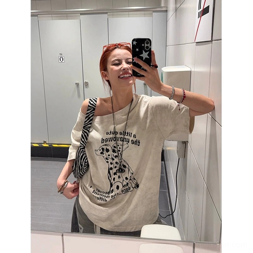 Back view of an apricot washed oversized Dalmatian T-shirt showing the clean plain back, drop-shoulder sleeves and loose casual fit