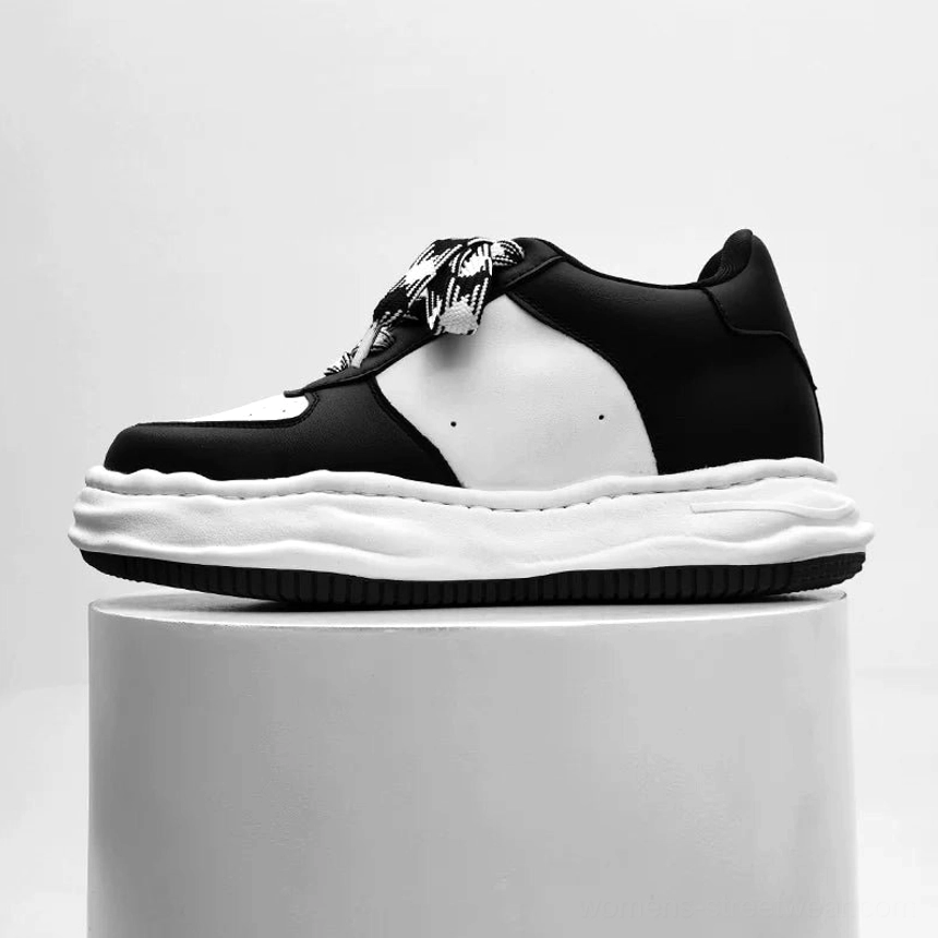 Arctic Crest black and white platform sneakers with color-block leather upper, decorative laces, and wavy thick sole