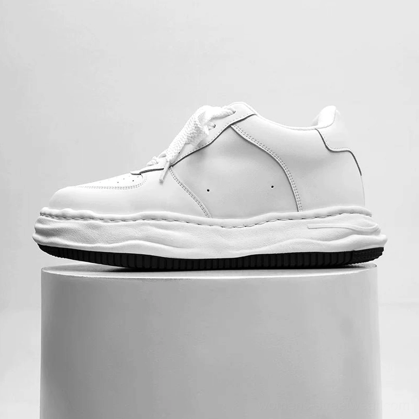 Arctic Crest white chunky platform skate sneaker side profile with black rubber outsole on gray pedestal