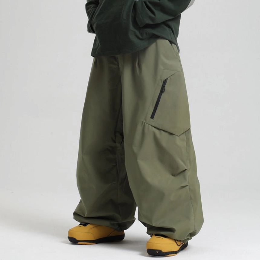Army green cargo snow pants male model dark top yellow boots thigh zipper pocket flap outdoor waterproof