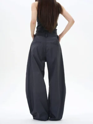Back full-body view of ash dark grey wide-leg palazzo streetwear pants showing the curved leg shape and rear pockets