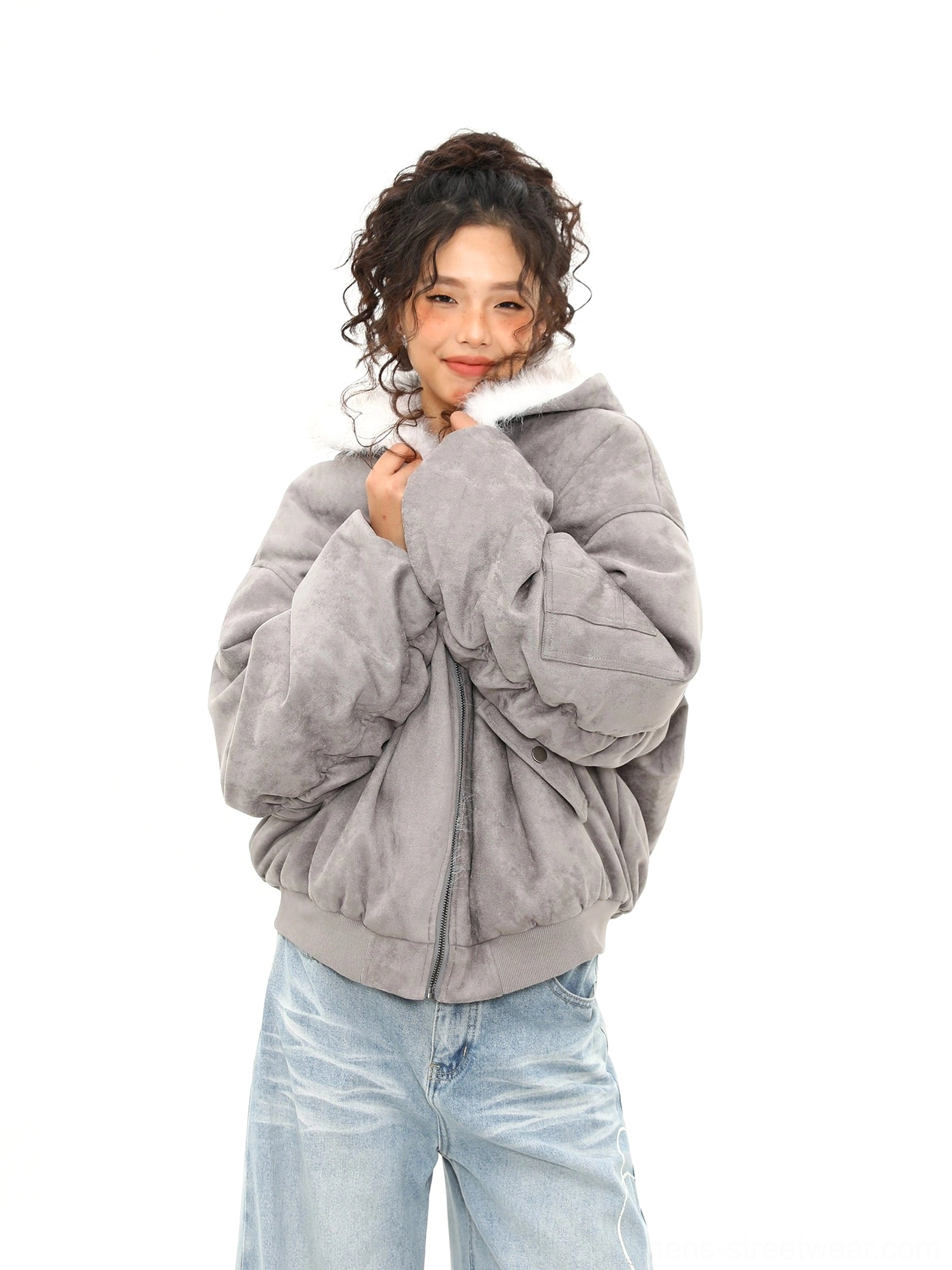 Close-up of ash gray oversized bomber jacket showing plush faux shearling collar ribbed hem and relaxed sleeves