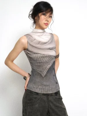 Left three quarter view of futuristic Y2K ash gray sleeveless layered knit tank top with ribbed panels and mock neck