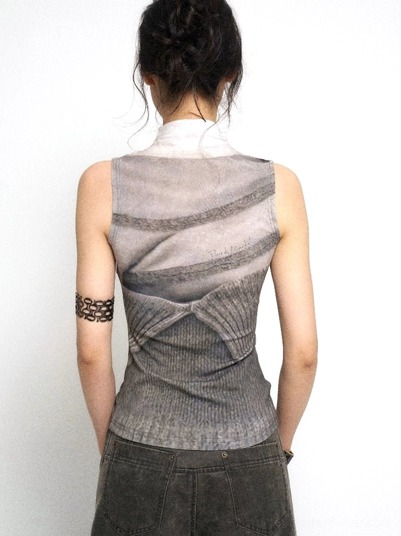 Back view of ash gray sleeveless layered knit tank top showing ruched detailing and textured panels styled with cargo pants