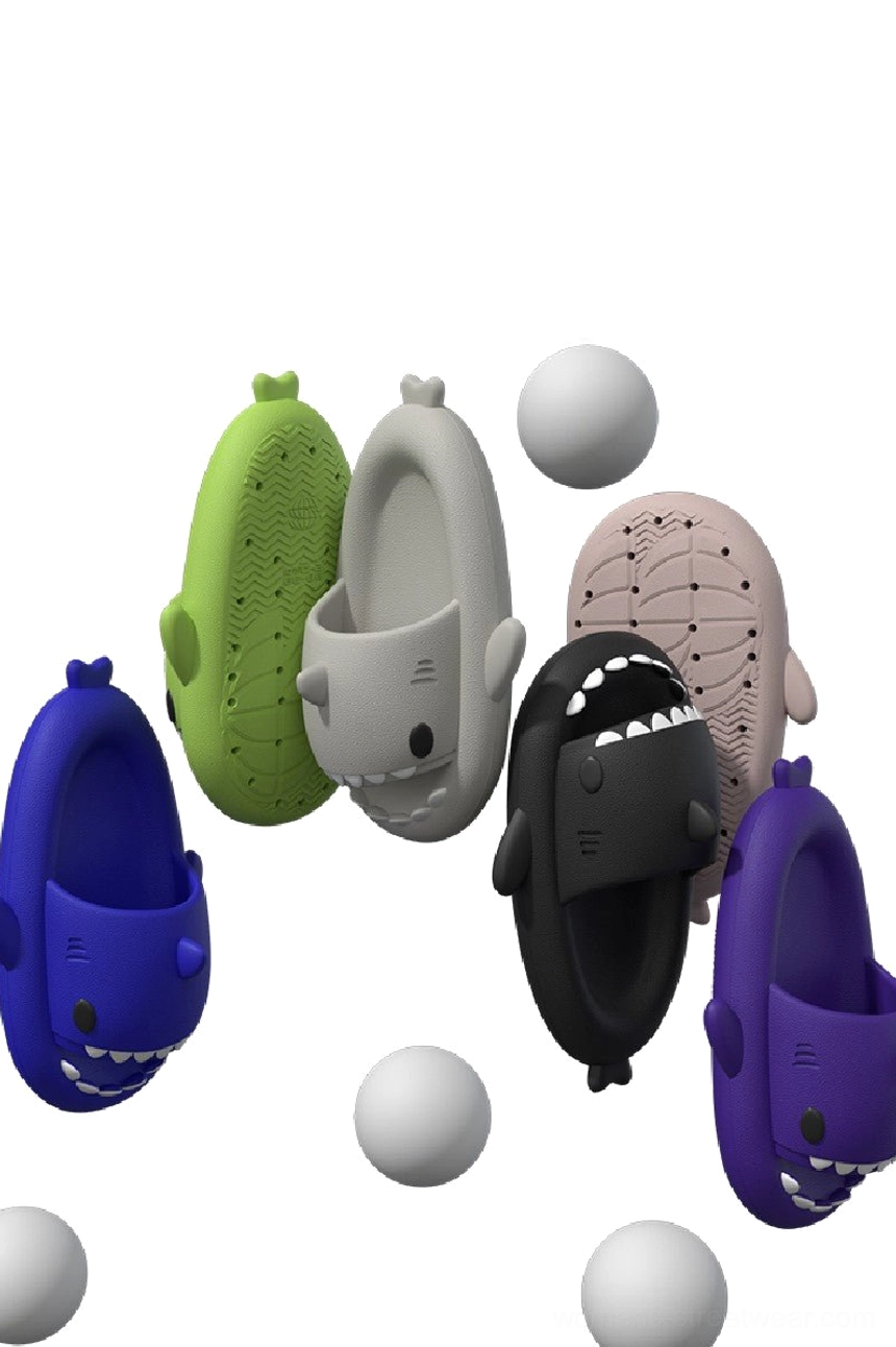 Assorted color shark slide slippers with cartoon shark shapes, open-toe slip-on design, and thick cushioned soles