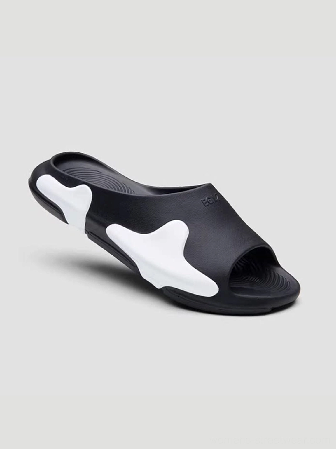 Single black and white asymmetric colorblock cloud cushion slide sandal with smooth molded EVA upper side view