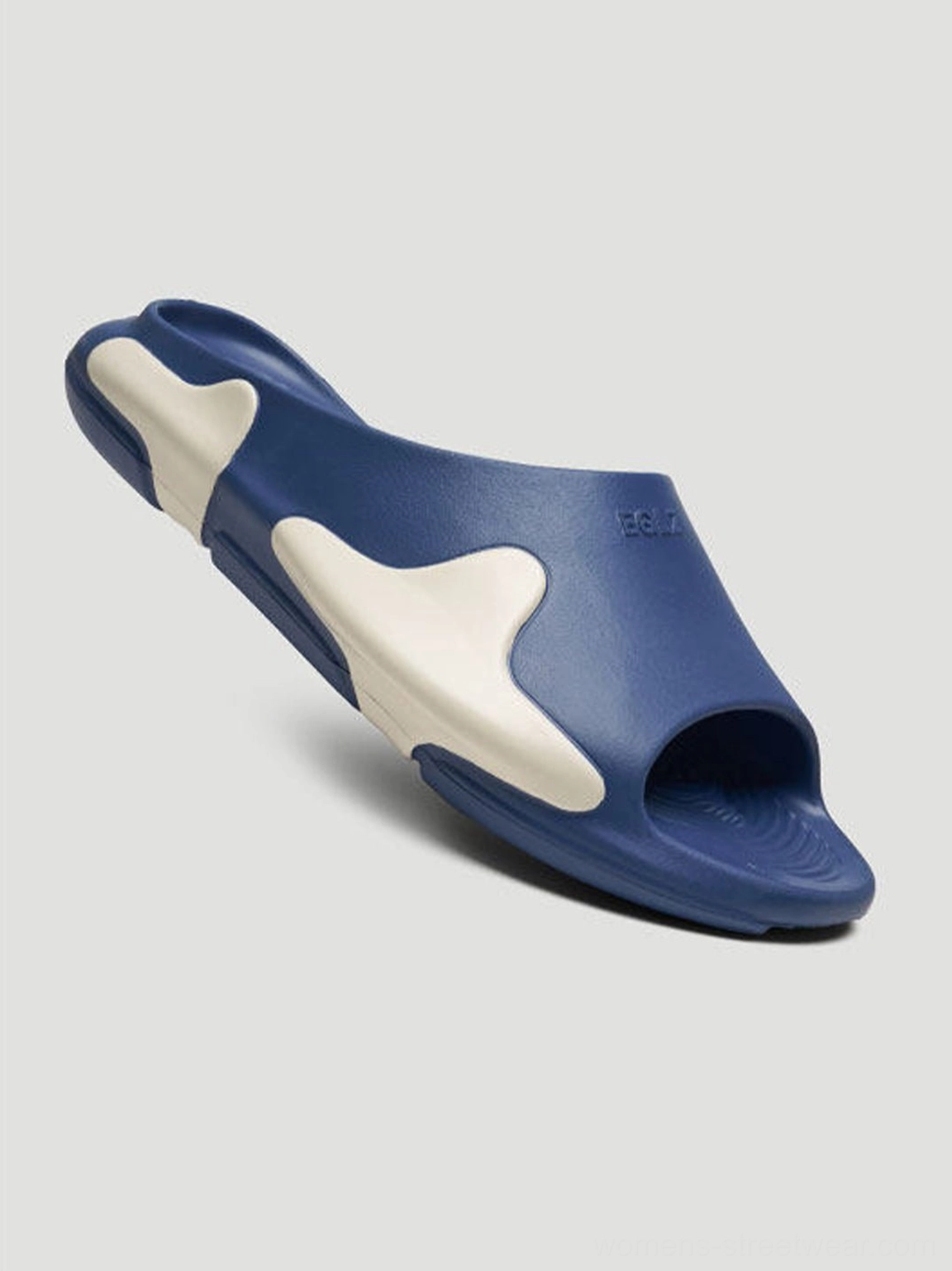 Asymmetric colorblock cloud cushion slide sandals close-up showing lightweight molded construction and contoured footbed