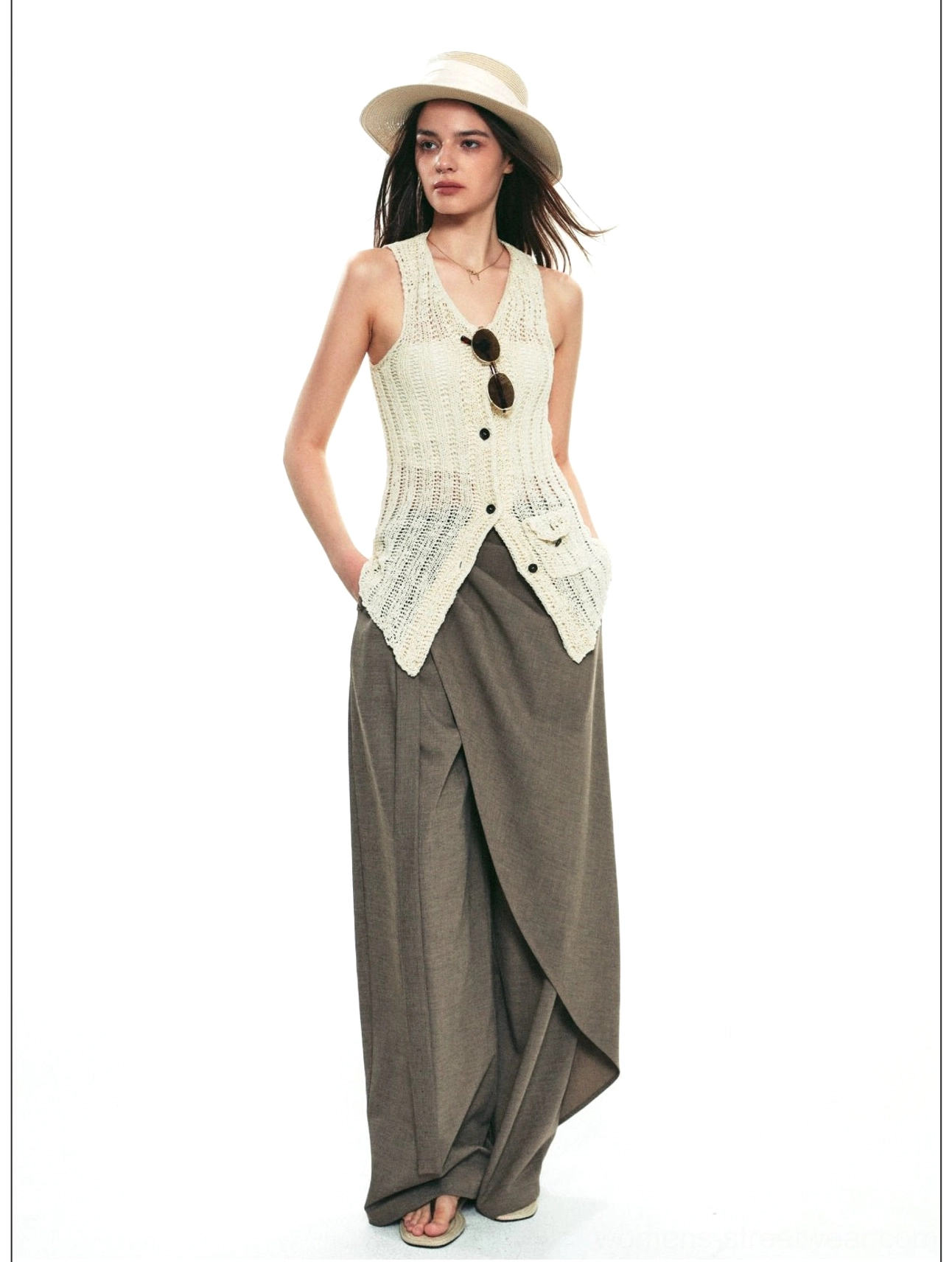 Brown gray draped wrap wide-leg pants with an off-white knit vest in a relaxed artistic streetwear look
