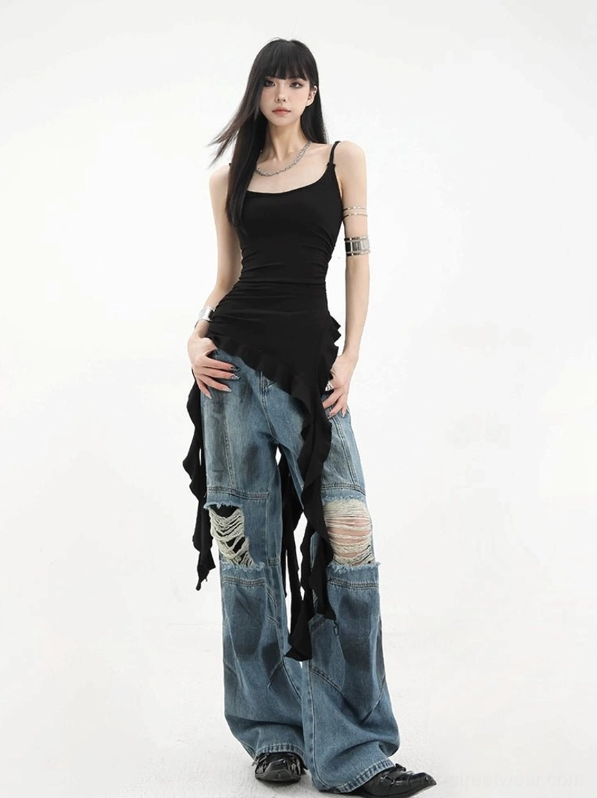 Full body front standing shot of asymmetric ribbon ruffle camisole tank with bodycon fitted silhouette and leather boots showing complete styling perspective