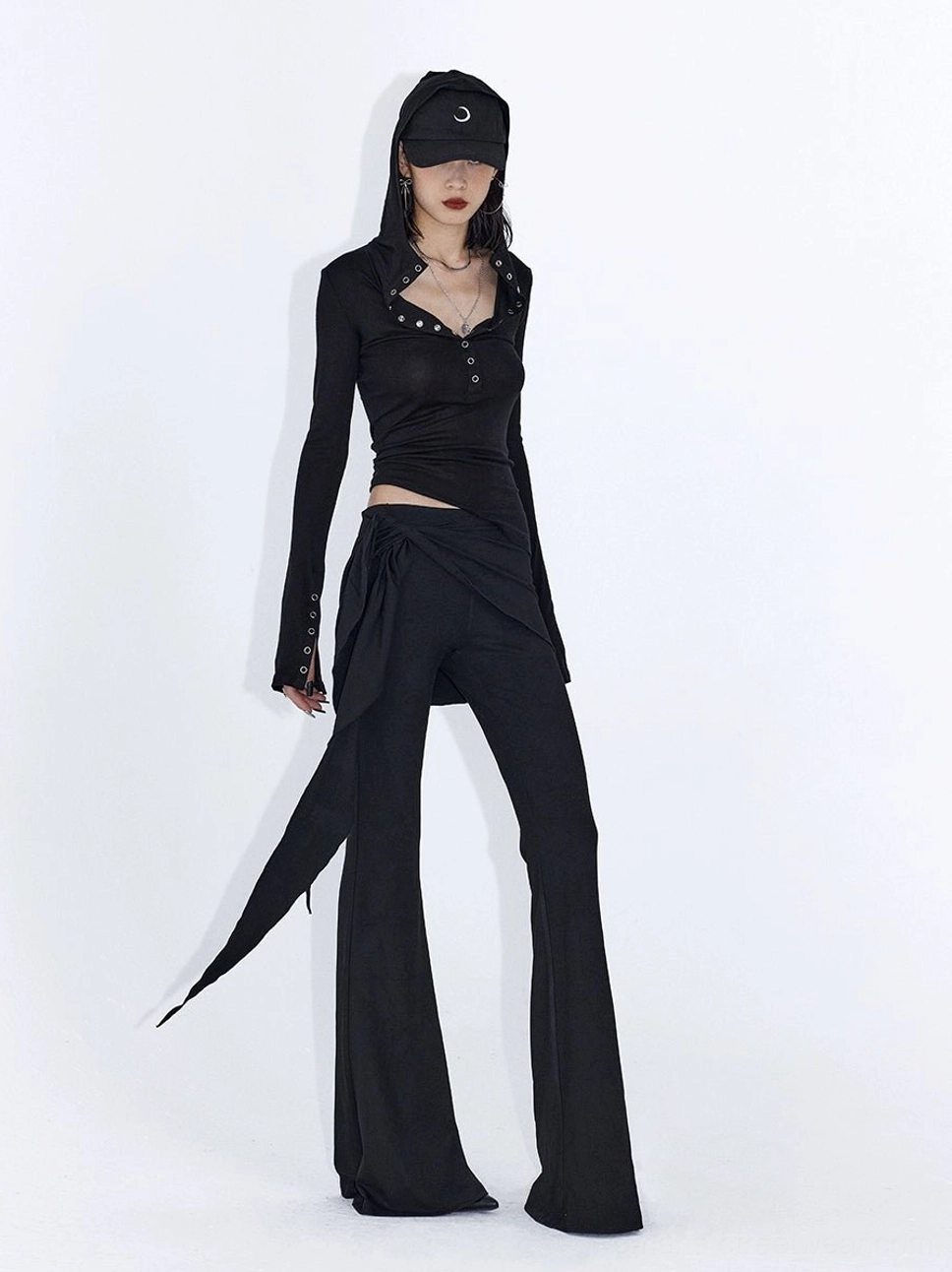 Asymmetric wrap drape flare streetwear pants in a fluid low rise silhouette with cascading waist detail