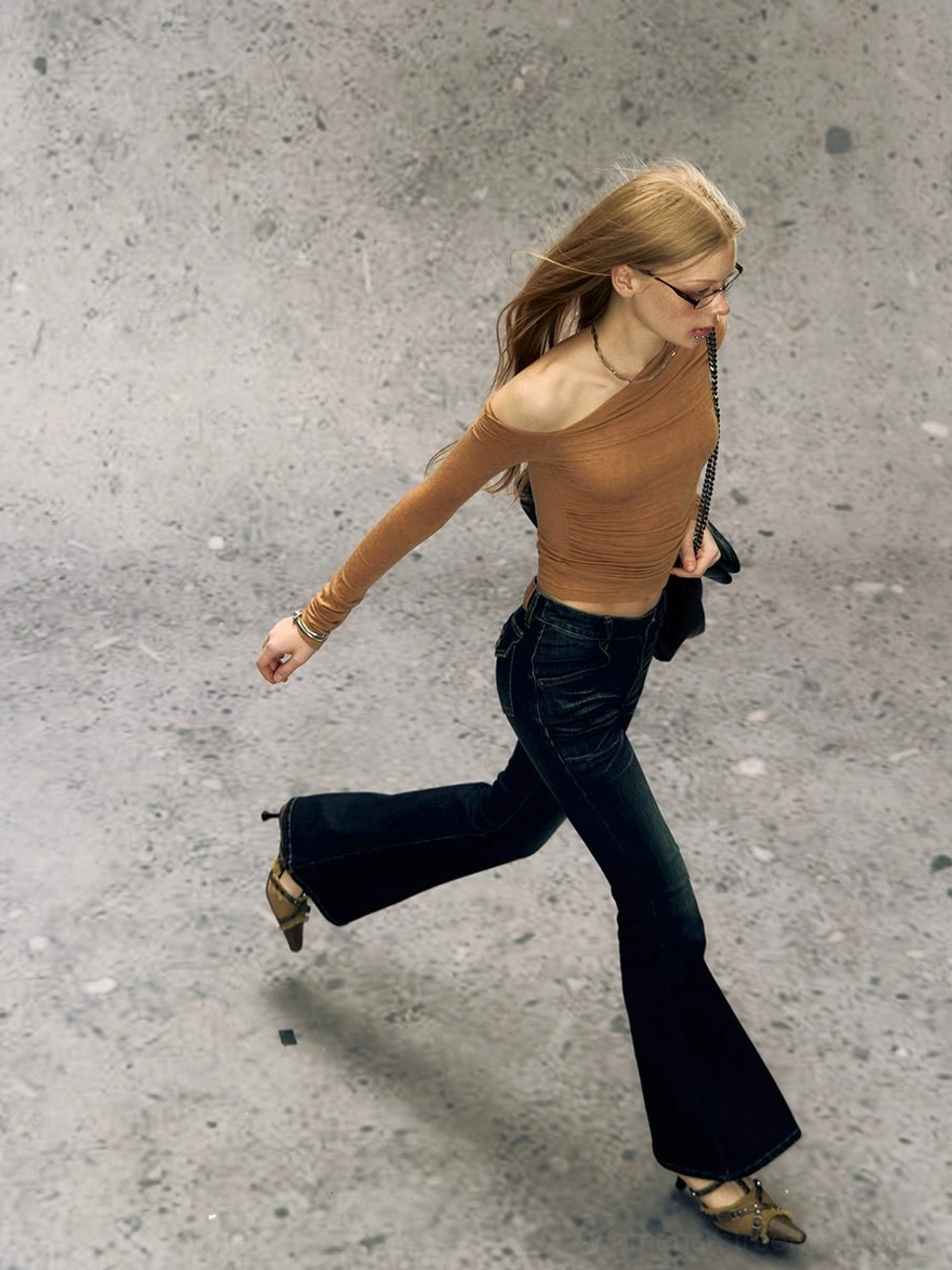 Caramel brown asymmetrical one-shoulder long sleeve Korean streetwear top with ruched waist detail on a female model